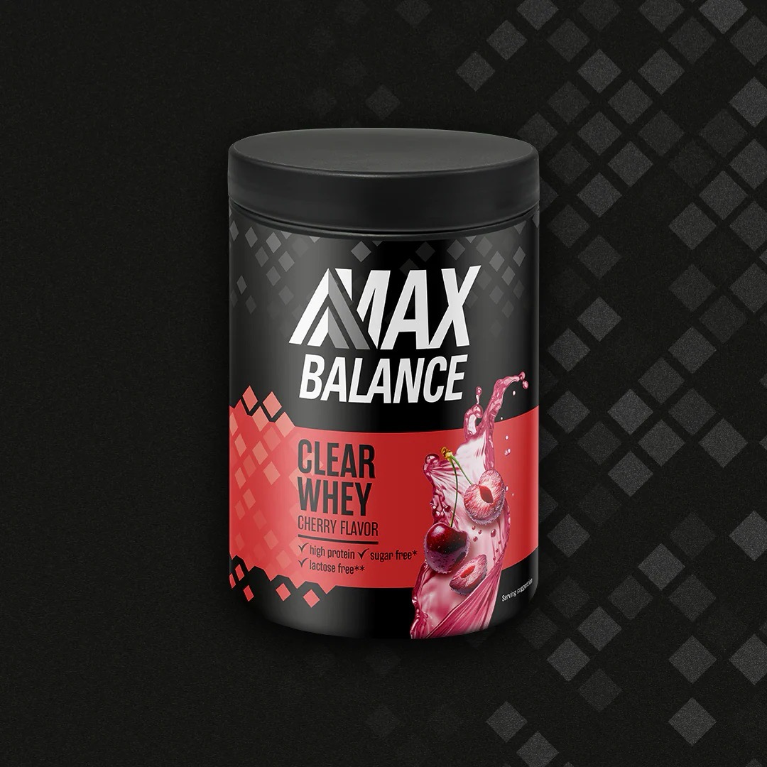 Eine Dose Clear Whey Cherry Flavor von Max Balance mit rotem Etikett.