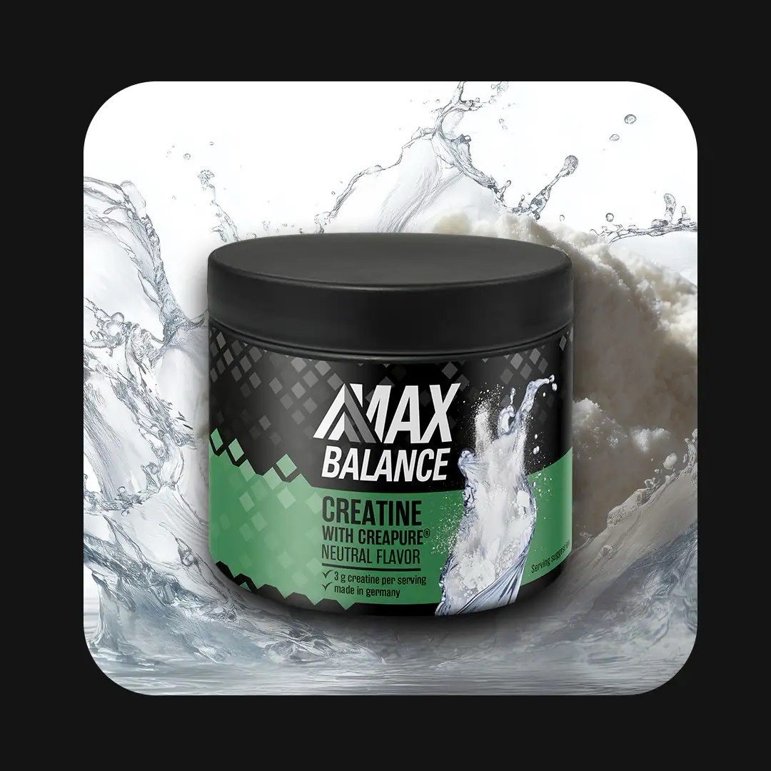 Eine Dose Creatine von Max Balance mit grünem Etikett.