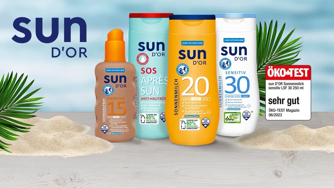 Verschiedene Sonnencremes und Après-Sun-Produkte von sun D'OR auf Sand mit ÖKO-TEST-Siegel sehr gut.