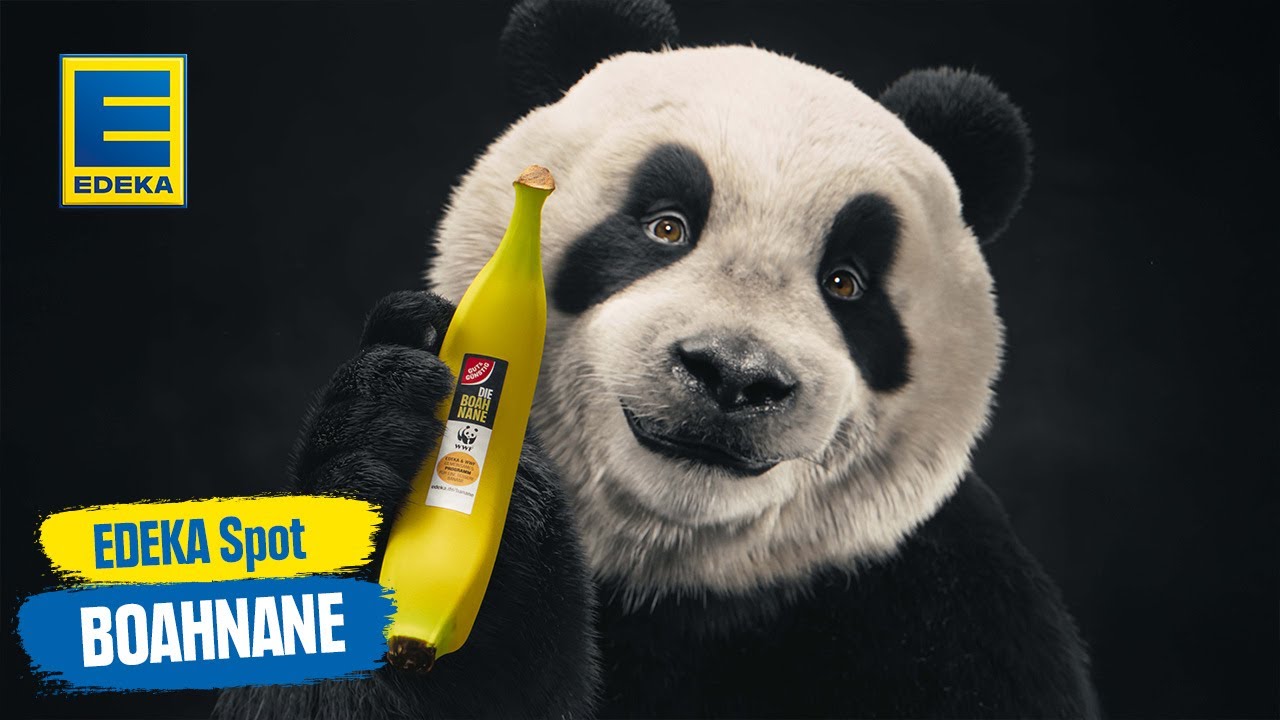 Ein Panda, der grinsend die BOAHNANE zeigt