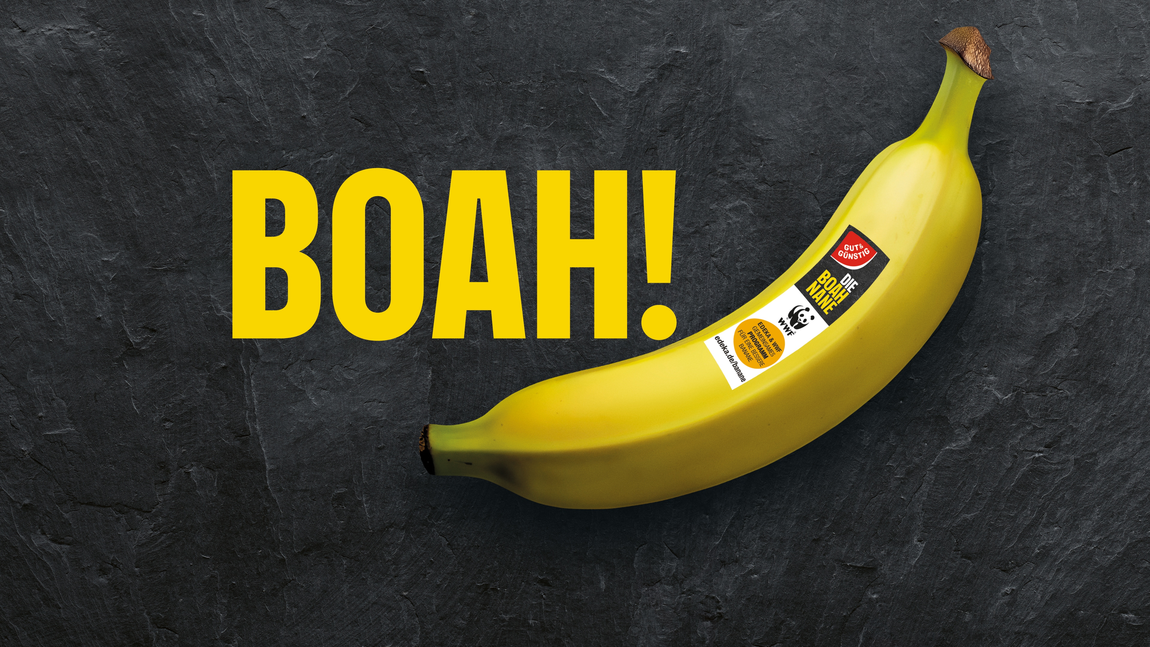 Eine Grafik mit einer Banane von Gut&Günstig, darüber in gelb der Schriftzug BOAH!, vor dunklem Hintergrund