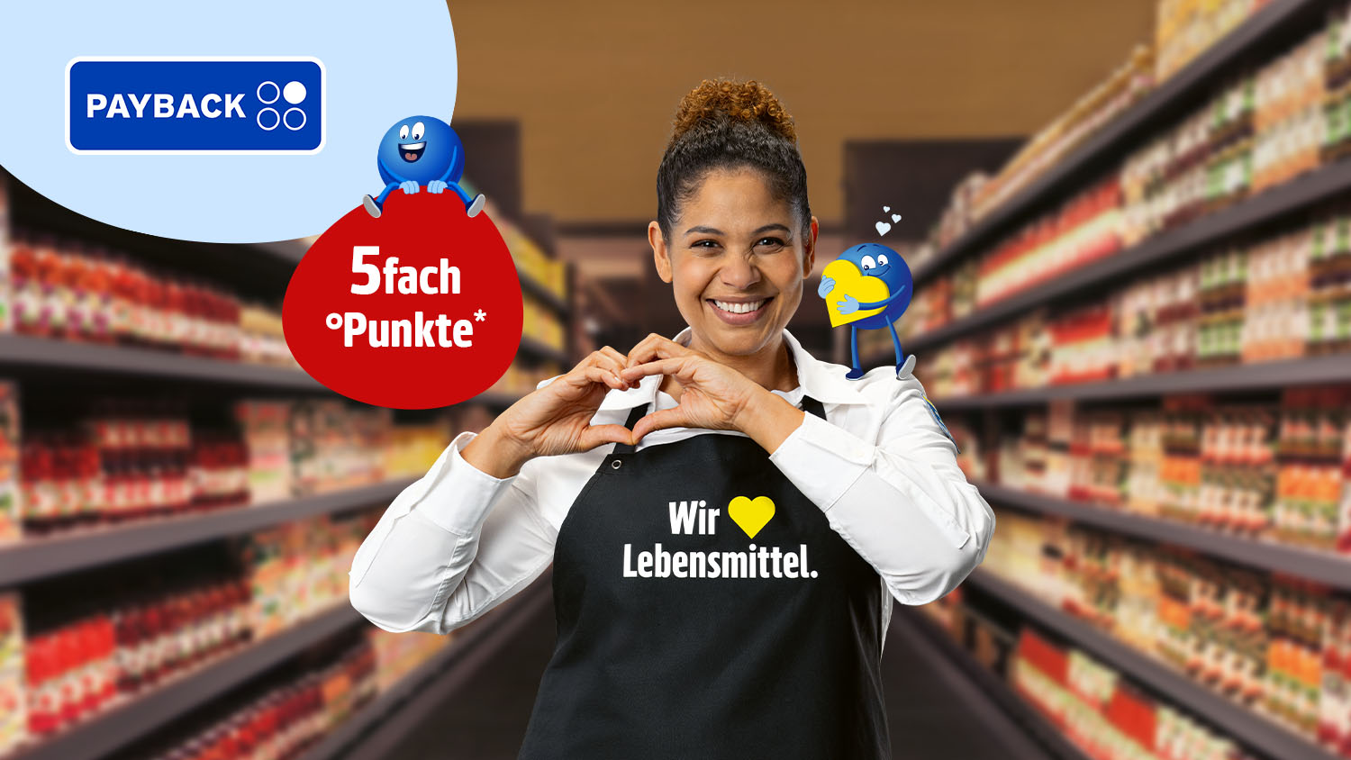 EDEKA-Marktmitarbeiterin mit schwarzer Schürze mit der Aufschrift "Wir lieben Lebensmittel.“ formt mit den Händen ein Herz; PAYBACK‑Werbung mit Störer "Jetzt punkten und sparen!“