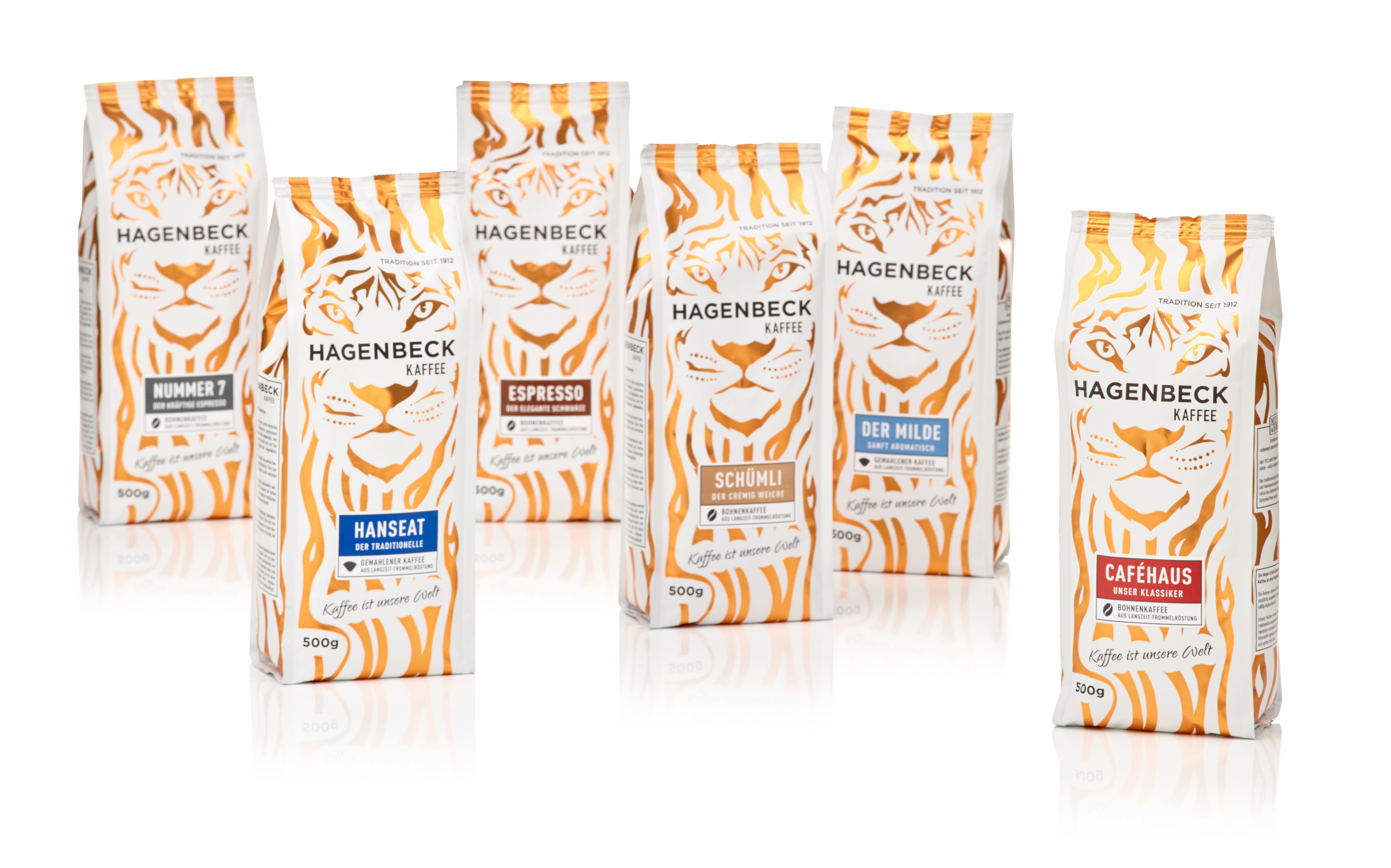 Sechs Packungen Kaffee im weiß gelb getigerten Design: Caféhaus, Nummer 7, Schümli, Espresso, der Milde sowie Hanseat..