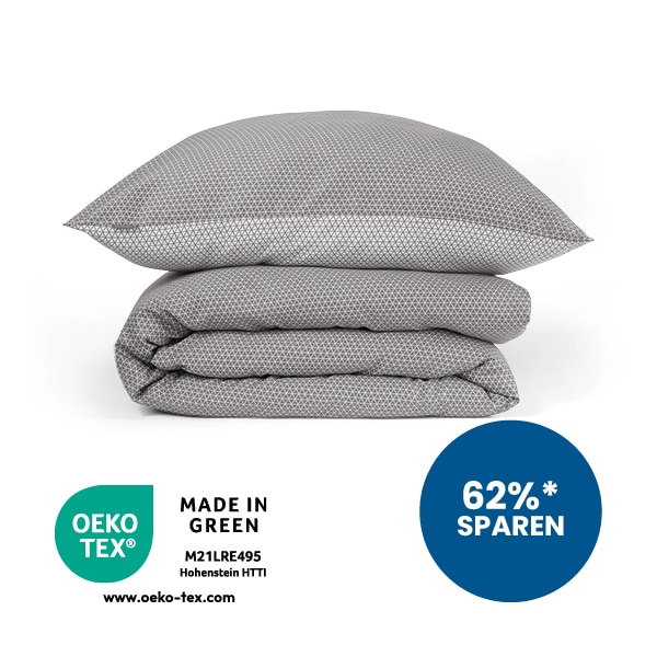 Kissen und Decke in anthrazit-weiß gestapelt aufeinander. 62% sparen Störer