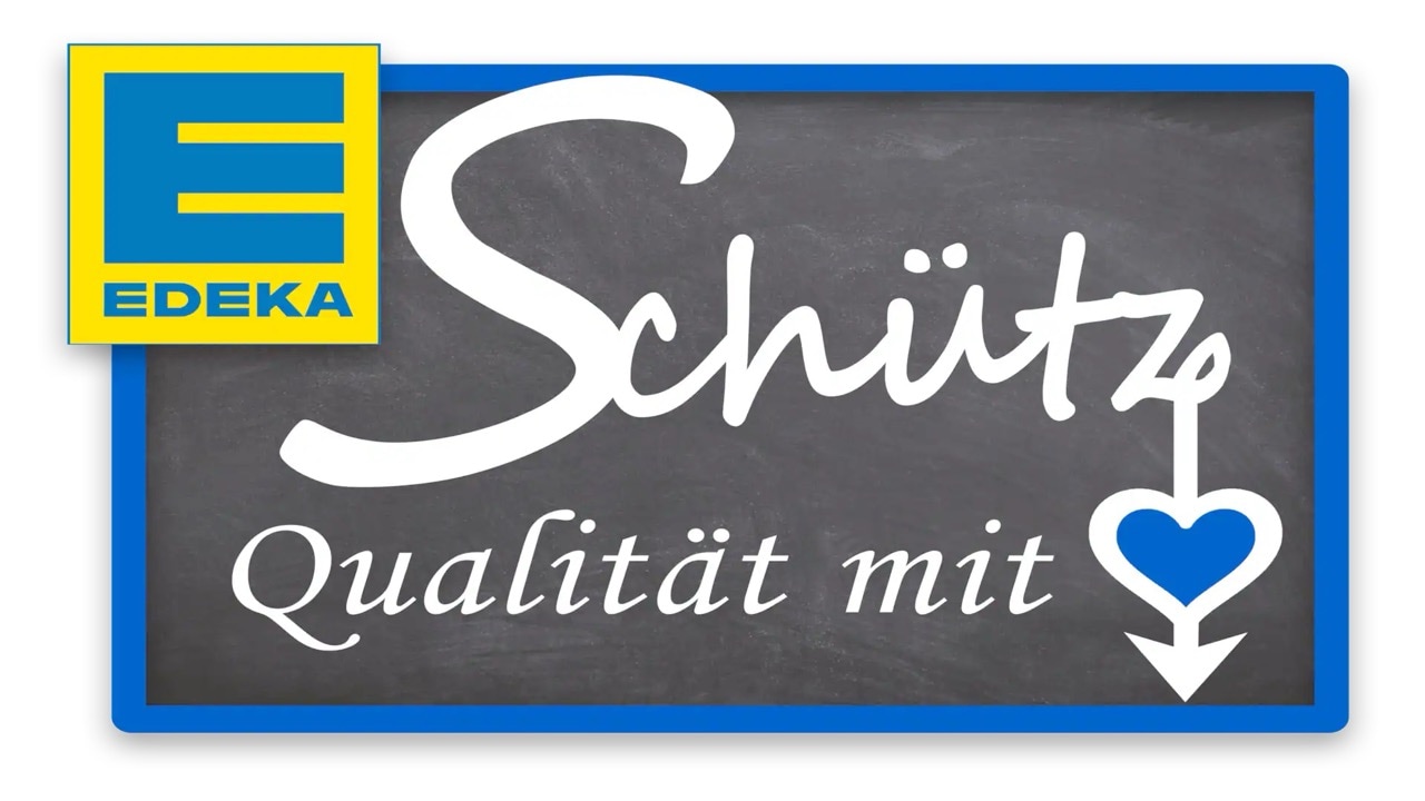 Text auf Kreidetafel: Schütz Qualität mit Herz. Dazu das EDEKA-Logo.