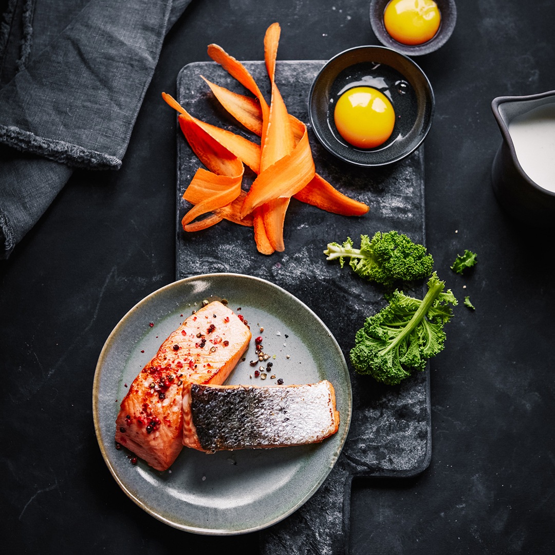 Lachs, Grünkohl oder Karotten sind Vitamin-A-Lieferanten