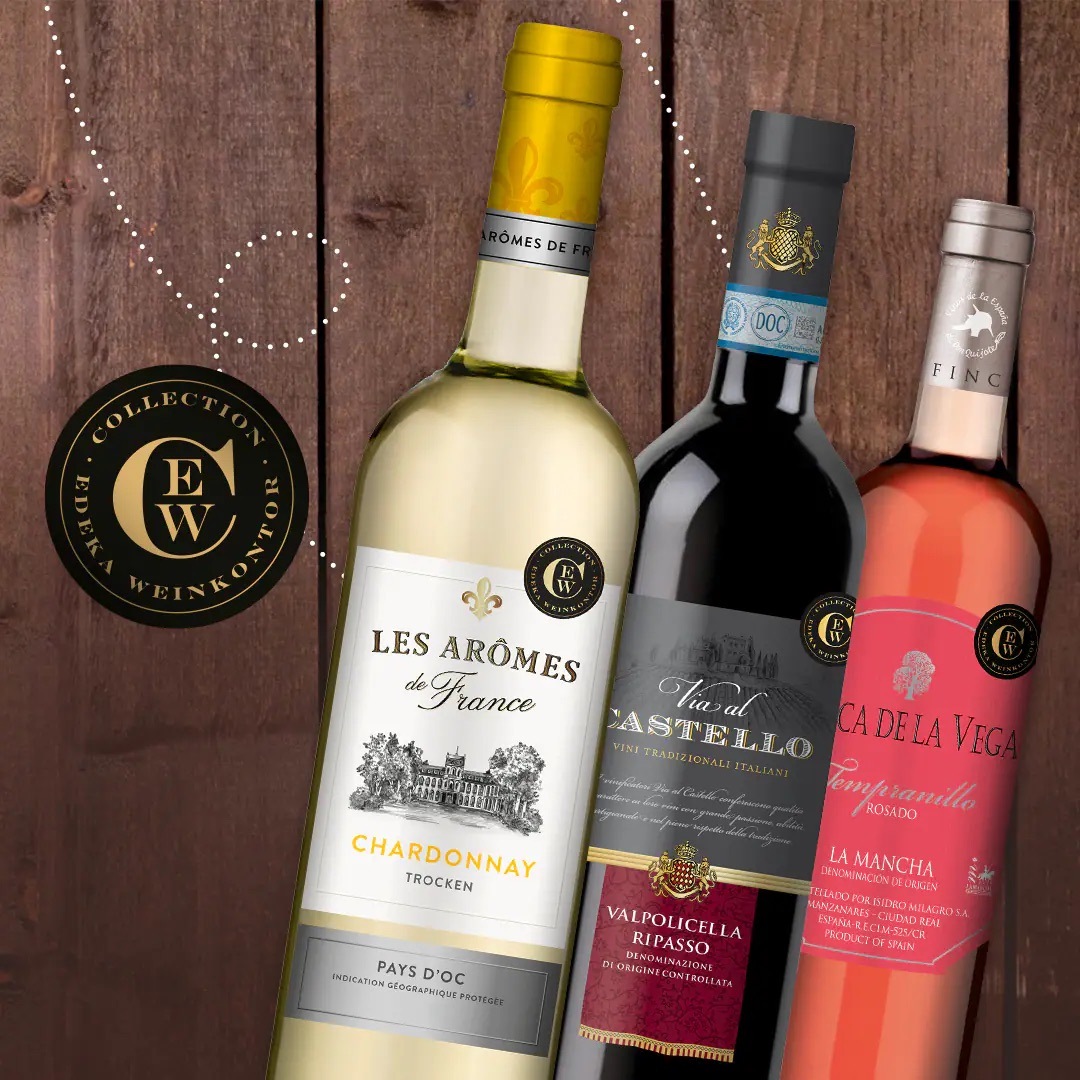 Drei Flaschen Wein der EDEKA Weinkontor Collection: Weiß, rot und rosé.